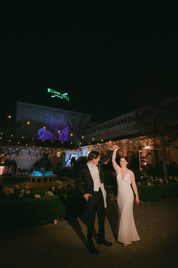 Bride and Groom mingling during reception in The Ebell’s garden courtyard