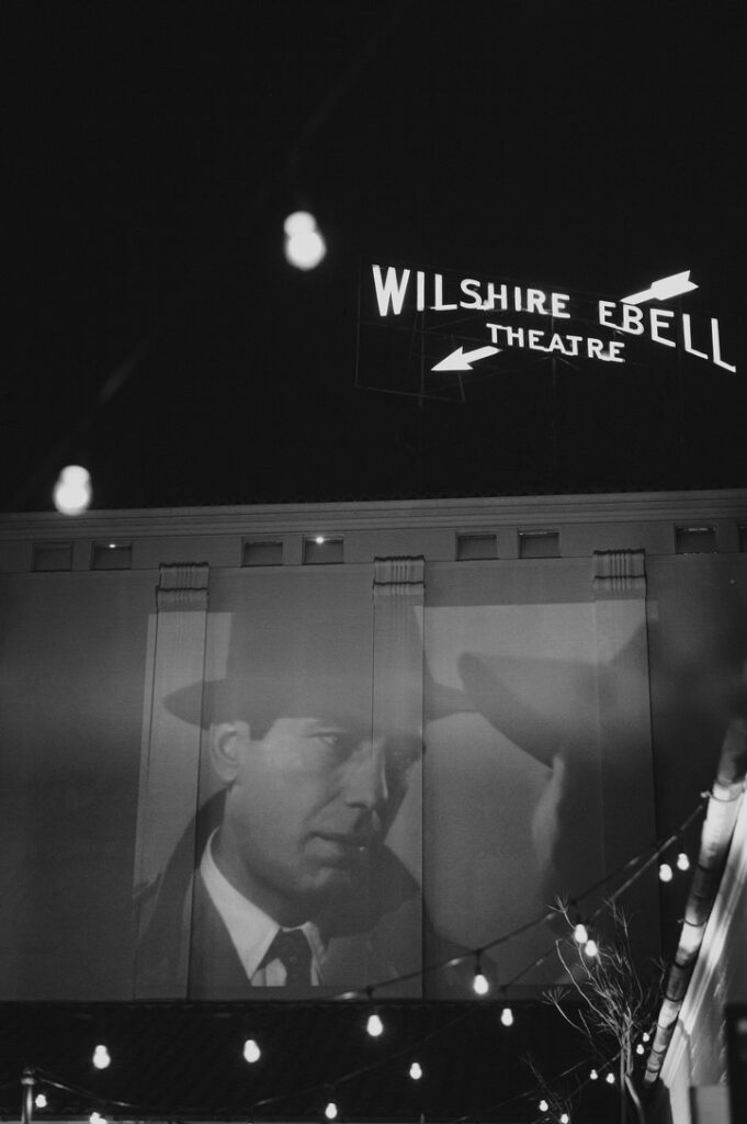 Silent film movie projection on roof of luxury venue in Los Angeles