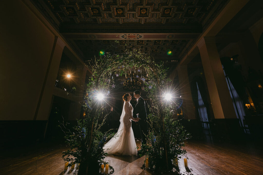 bridal portrait of bride and groom after ceremony in ballroom